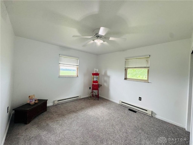 1637 Lammes Ln, New Carlisle, OH 45344 - carpeted spare room with a baseboard radiator, plenty of natural light, and ceiling fan