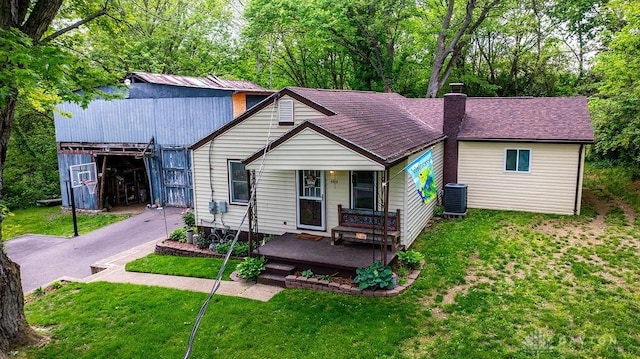 4510 Trenton Franklin Rd, Middletown, OH 45042 - view of front of home with covered porch, a chimney, and a front yard