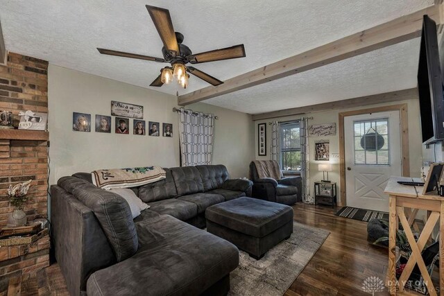 4510 Trenton Franklin Rd, Middletown, OH 45042 - living room with a textured ceiling, ceiling fan, wood finished floors, and beamed ceiling