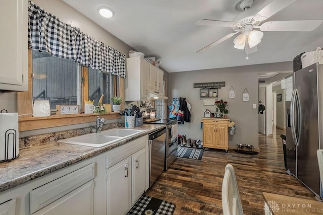 4510 Trenton Franklin Rd, Middletown, OH 45042 - kitchen with stainless steel appliances, a ceiling fan, dark wood finished floors, light countertops, and white cabinetry