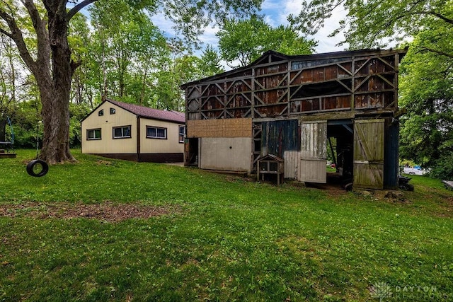 4510 Trenton Franklin Rd, Middletown, OH 45042 - rear view of house featuring a lawn and an outdoor structure