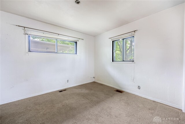 619 Storms Rd, Kettering, OH 45429 - unfurnished room with plenty of natural light and carpet flooring