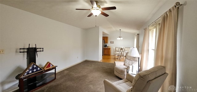 919 N Cherry St, Eaton, OH 45320 - living room with vaulted ceiling, ceiling fan, carpet flooring, and a chandelier
