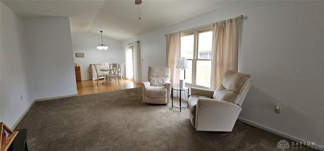 919 N Cherry St, Eaton, OH 45320 - living area with carpet, lofted ceiling, a chandelier, and ceiling fan