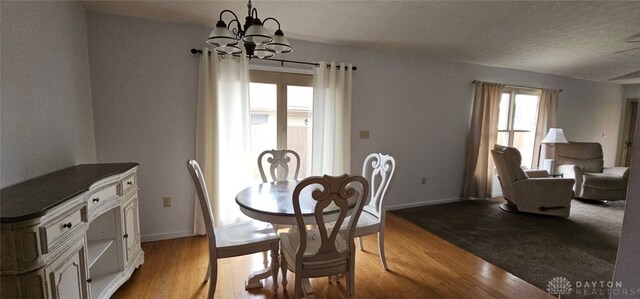 919 N Cherry St, Eaton, OH 45320 - dining space featuring a chandelier and wood finished floors
