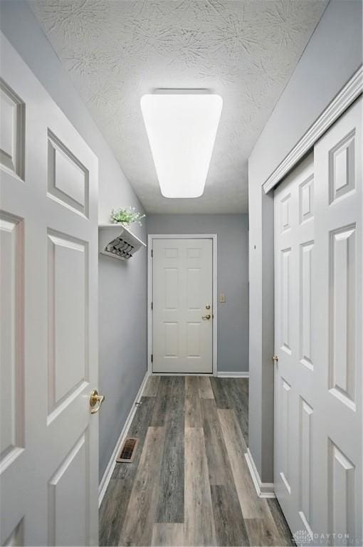 5015 Riverview Ave, Middletown, OH 45042 - doorway to outside with wood finished floors and a textured ceiling