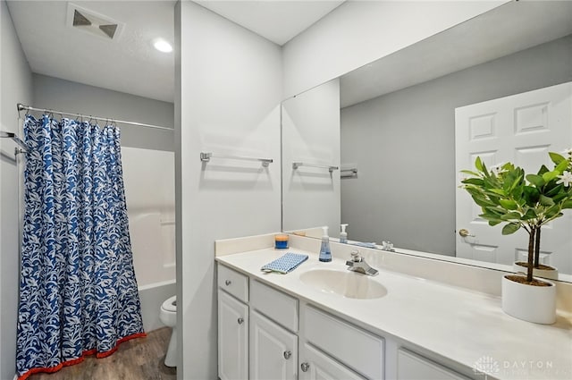 5015 Riverview Ave, Middletown, OH 45042 - bathroom featuring wood finished floors, vanity, and shower / tub combo