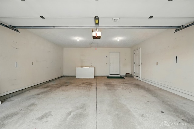 5015 Riverview Ave, Middletown, OH 45042 - garage featuring a garage door opener and fridge