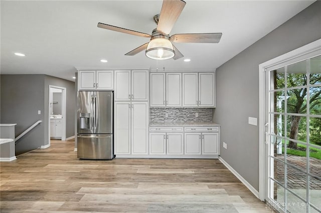 5015 Riverview Ave, Middletown, OH 45042 - kitchen featuring stainless steel fridge with ice dispenser, recessed lighting, backsplash, light wood finished floors, and ceiling fan