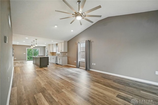 5015 Riverview Ave, Middletown, OH 45042 - unfurnished living room featuring ceiling fan, light wood-style floors, recessed lighting, and high vaulted ceiling