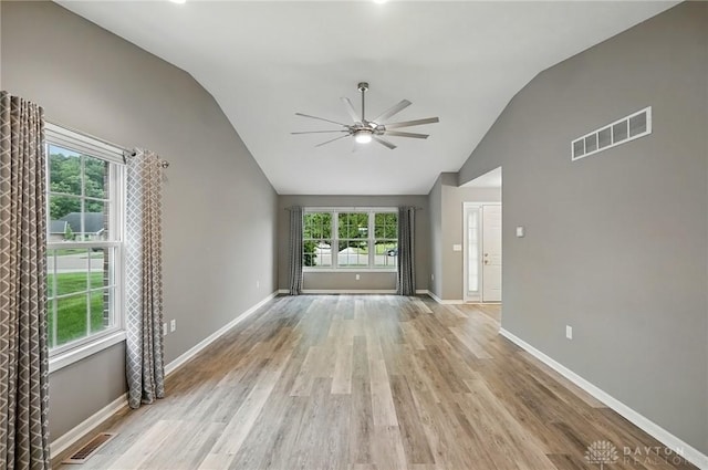 5015 Riverview Ave, Middletown, OH 45042 - unfurnished living room featuring vaulted ceiling, ceiling fan, and light wood-type flooring
