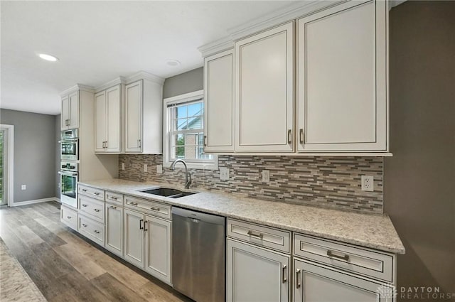 5015 Riverview Ave, Middletown, OH 45042 - kitchen featuring stainless steel appliances, wood finished floors, decorative backsplash, and recessed lighting