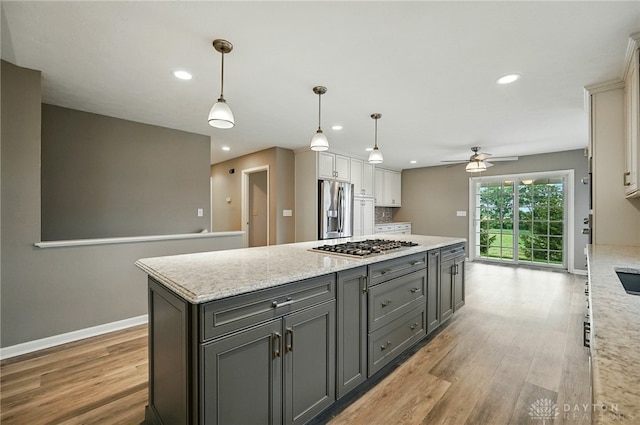 5015 Riverview Ave, Middletown, OH 45042 - kitchen featuring light wood-style floors, stainless steel appliances, a ceiling fan, gray cabinets, and recessed lighting