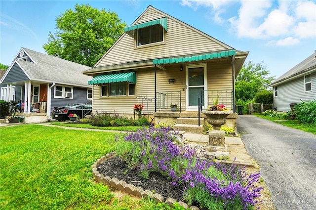 2540 Acorn Dr, Kettering, OH 45419 - view of front of property with a front lawn, driveway, and covered porch