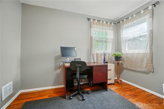 2540 Acorn Dr, Kettering, OH 45419 - office area with healthy amount of natural light, wood finished floors, and ornamental molding