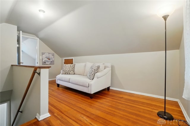 2540 Acorn Dr, Kettering, OH 45419 - sitting room featuring an upstairs landing, lofted ceiling, and wood finished floors