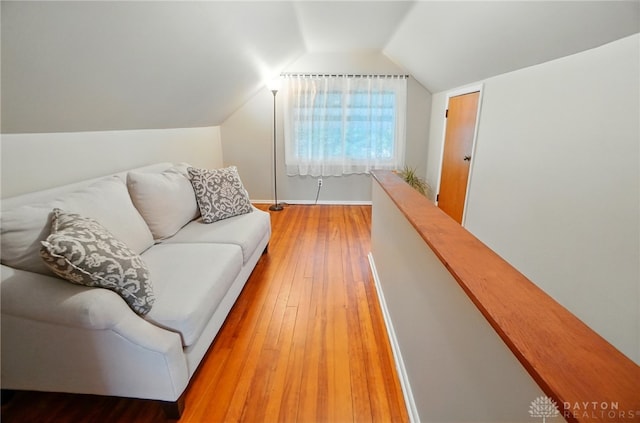 2540 Acorn Dr, Kettering, OH 45419 - living area featuring light wood-type flooring and vaulted ceiling