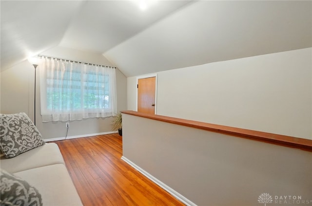 2540 Acorn Dr, Kettering, OH 45419 - bonus room featuring wood finished floors and vaulted ceiling