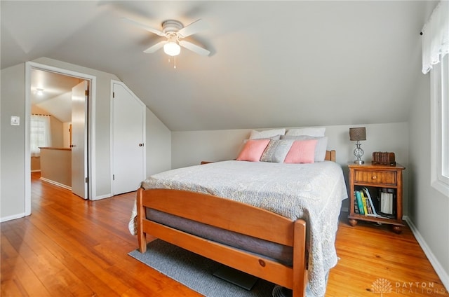 2540 Acorn Dr, Kettering, OH 45419 - bedroom with light wood-style floors, lofted ceiling, and a ceiling fan