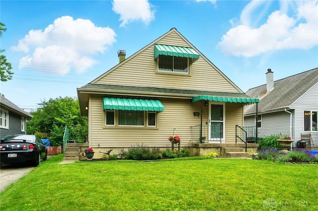 2540 Acorn Dr, Kettering, OH 45419 - bungalow featuring a front yard and a chimney