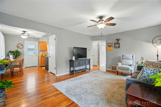 2540 Acorn Dr, Kettering, OH 45419 - living area featuring a ceiling fan and light wood-style flooring