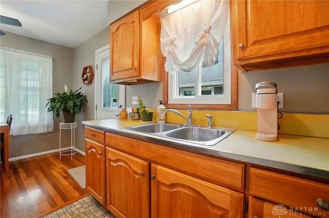 2540 Acorn Dr, Kettering, OH 45419 - kitchen with brown cabinets, light countertops, and wood finished floors