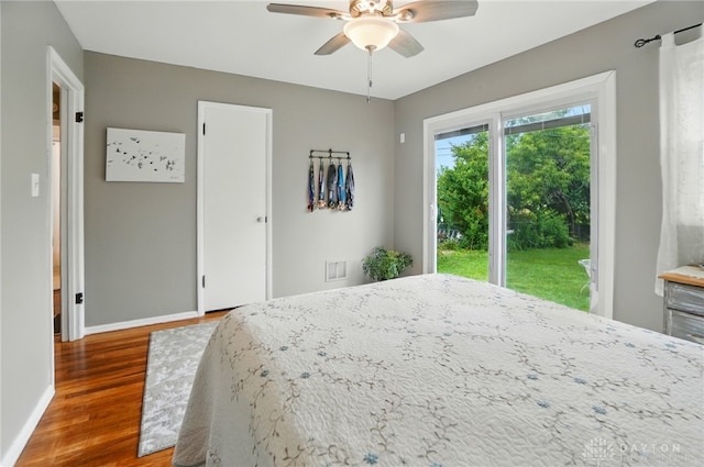 2540 Acorn Dr, Kettering, OH 45419 - bedroom featuring wood finished floors, access to outside, and ceiling fan
