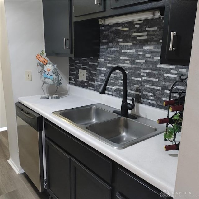 1116 Eagle Feather Cir Unit B, West Carrollton, OH 45449 - kitchen featuring stainless steel dishwasher, decorative backsplash, wood finished floors, and light countertops