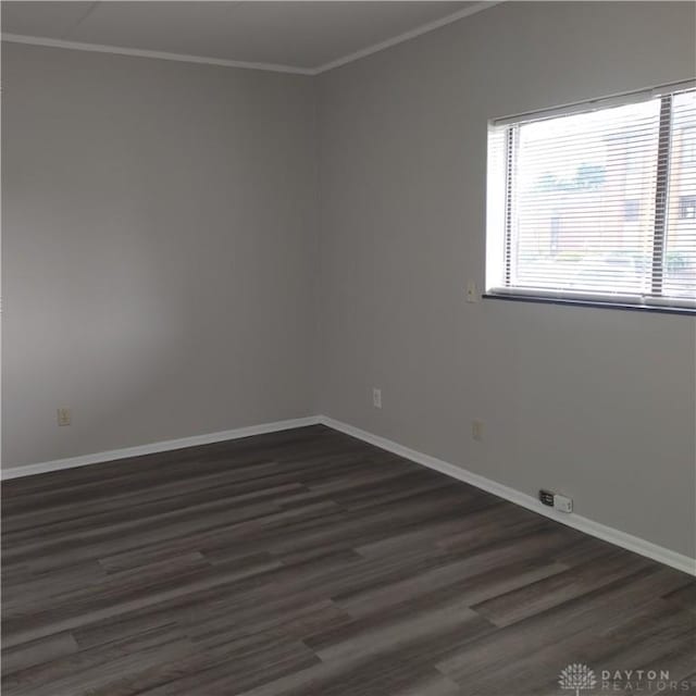 1116 Eagle Feather Cir Unit B, West Carrollton, OH 45449 - spare room with dark wood finished floors and crown molding