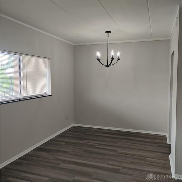 1116 Eagle Feather Cir Unit B, West Carrollton, OH 45449 - spare room featuring crown molding, a chandelier, and dark wood-style floors