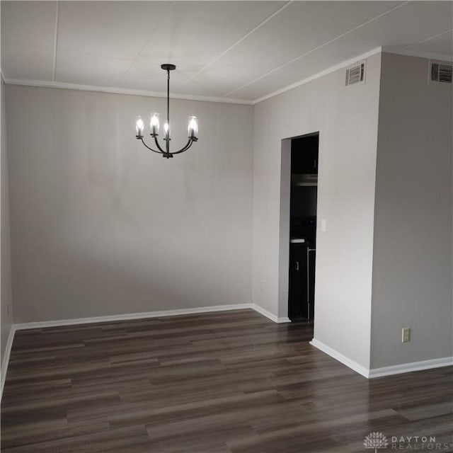1116 Eagle Feather Cir Unit B, West Carrollton, OH 45449 - unfurnished dining area featuring a chandelier, dark wood-style flooring, and ornamental molding
