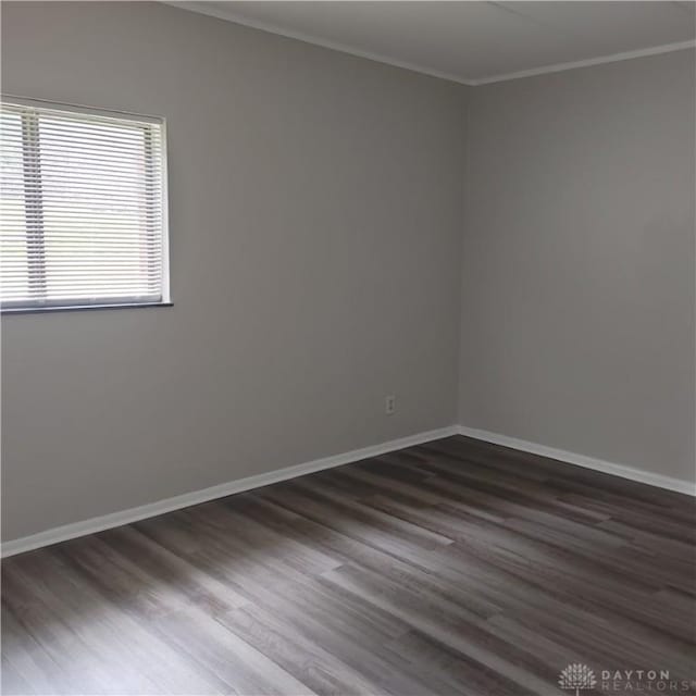 1116 Eagle Feather Cir Unit B, West Carrollton, OH 45449 - unfurnished room featuring dark wood-type flooring and ornamental molding