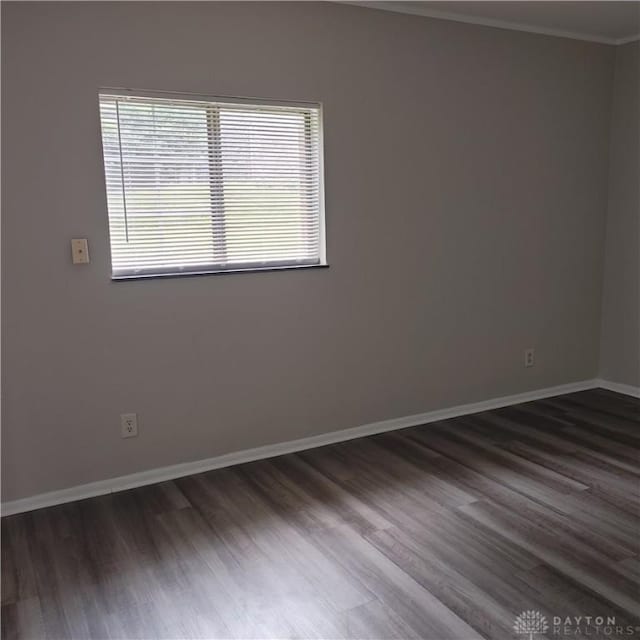 1116 Eagle Feather Cir Unit B, West Carrollton, OH 45449 - empty room with healthy amount of natural light, dark wood finished floors, and ornamental molding