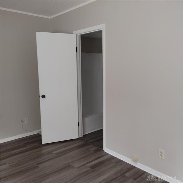 1116 Eagle Feather Cir Unit B, West Carrollton, OH 45449 - unfurnished room with dark wood-type flooring and crown molding