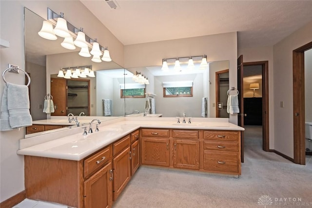 1241 Wind Field Ct, Washington Twp, OH 45458 - bathroom with double vanity and baseboards