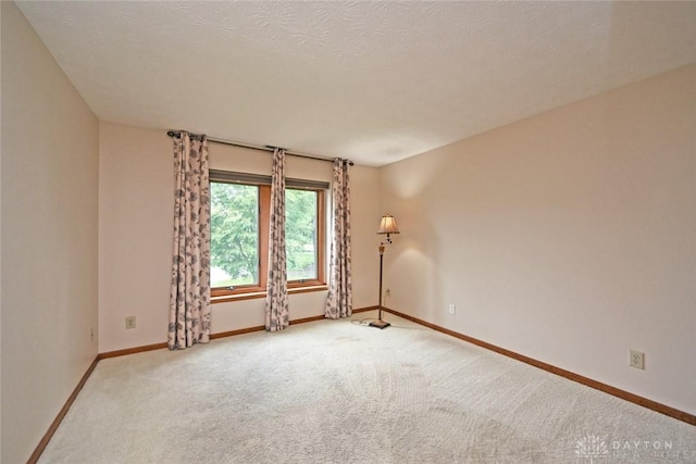1241 Wind Field Ct, Washington Twp, OH 45458 - unfurnished room featuring carpet floors and a textured ceiling