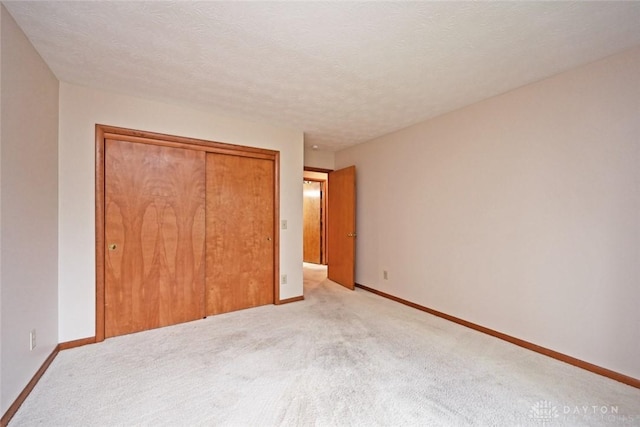 1241 Wind Field Ct, Washington Twp, OH 45458 - unfurnished bedroom featuring a closet and light carpet