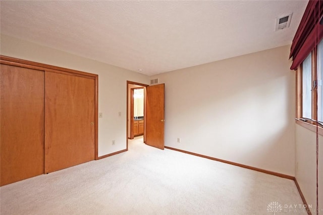 1241 Wind Field Ct, Washington Twp, OH 45458 - unfurnished bedroom featuring light colored carpet and a closet