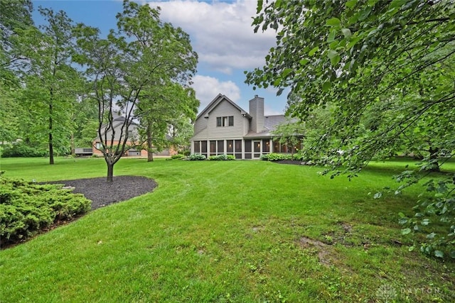 1241 Wind Field Ct, Washington Twp, OH 45458 - view of green lawn with a sunroom