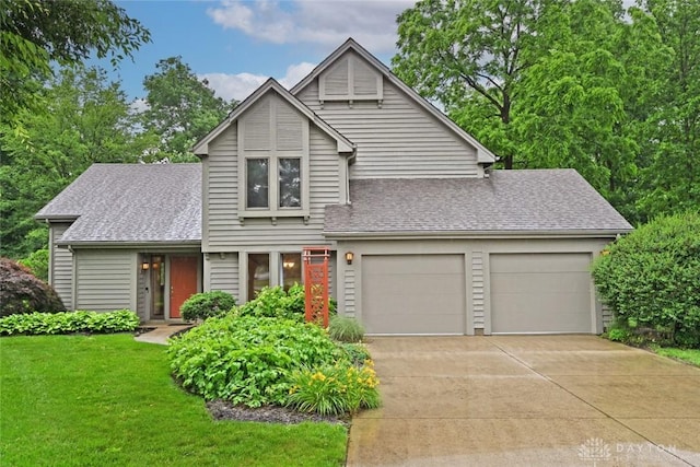1241 Wind Field Ct, Washington Twp, OH 45458 - view of front of house with a garage, concrete driveway, roof with shingles, and a front yard