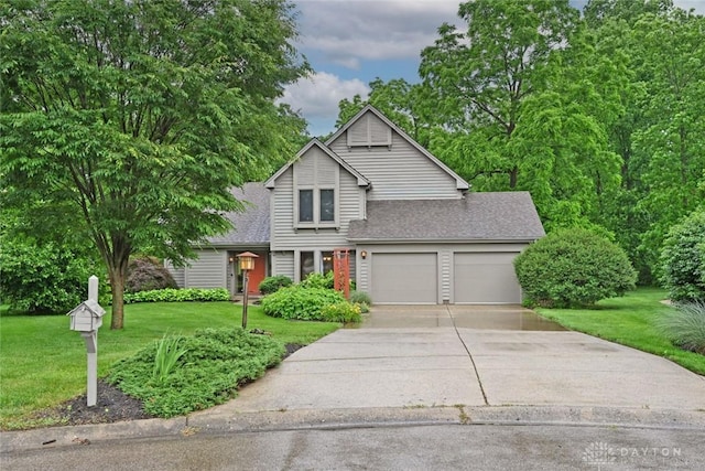 1241 Wind Field Ct, Washington Twp, OH 45458 - traditional home featuring a front yard, a shingled roof, driveway, and an attached garage