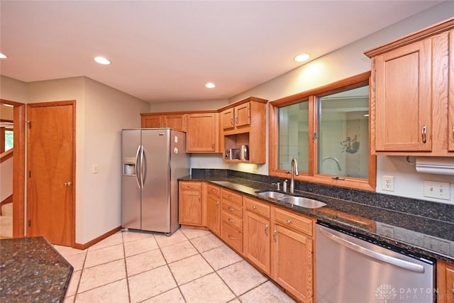 1241 Wind Field Ct, Washington Twp, OH 45458 - kitchen featuring appliances with stainless steel finishes, dark stone counters, recessed lighting, and light tile patterned floors