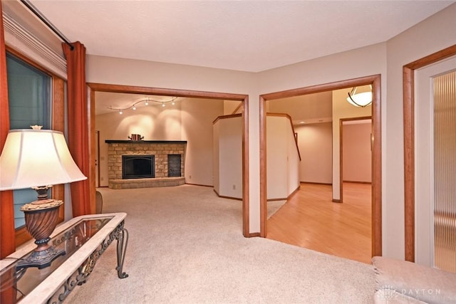 1241 Wind Field Ct, Washington Twp, OH 45458 - living area featuring light carpet and a stone fireplace