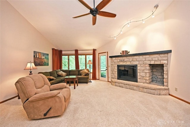 1241 Wind Field Ct, Washington Twp, OH 45458 - carpeted living room with a ceiling fan, a stone fireplace, and lofted ceiling
