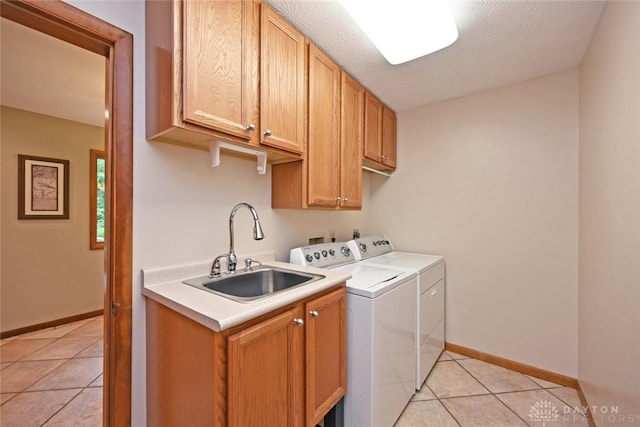 1241 Wind Field Ct, Washington Twp, OH 45458 - laundry area featuring cabinet space, separate washer and dryer, and light tile patterned flooring