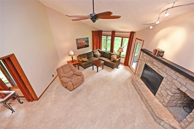 1241 Wind Field Ct, Washington Twp, OH 45458 - living area with a glass covered fireplace, carpet floors, vaulted ceiling, and ceiling fan
