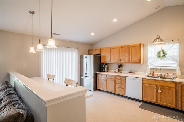 21 Meadowcrest Dr, Franklin, OH 45005 - kitchen with white dishwasher, freestanding refrigerator, lofted ceiling, plenty of natural light, and light flooring