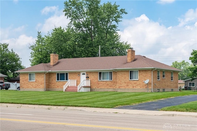 923 E National Rd, Vandalia, OH 45377 - ranch-style home with a chimney, brick siding, a front yard, and a shingled roof