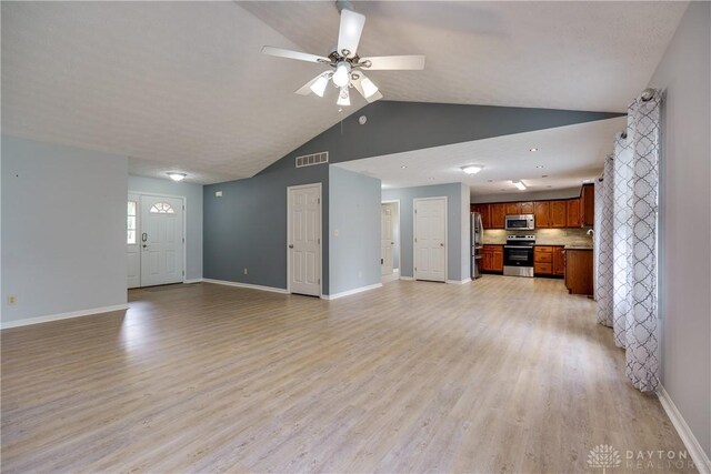 1360 Adamsmoor Dr, Waynesville, OH 45068 - unfurnished living room featuring vaulted ceiling, ceiling fan, and light wood-type flooring