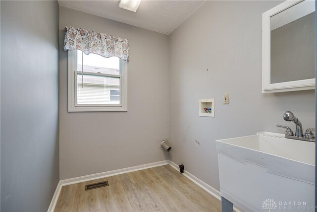 1360 Adamsmoor Dr, Waynesville, OH 45068 - washroom with light wood finished floors and washer hookup